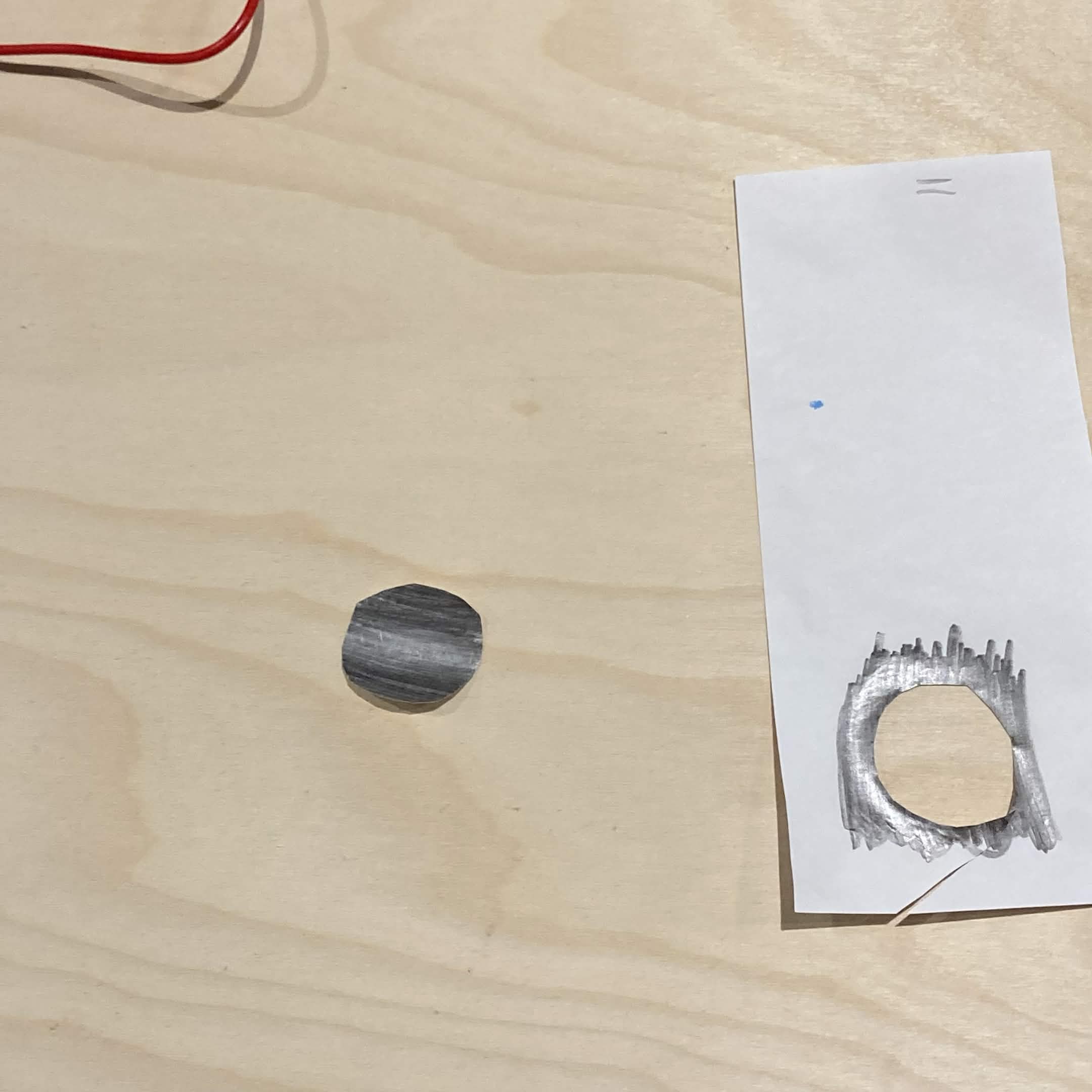 Graphite circle I cut out to use as a conductive item